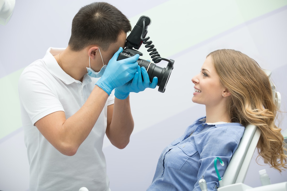 dental braces patient getting orthodontic photography picture taken after completing orthodontic treatment