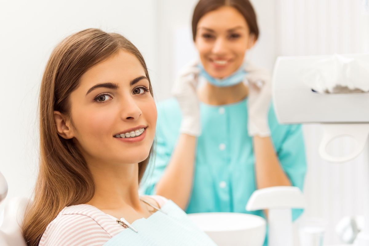 Orthodontic patient getting a check up at her modern orthodontist