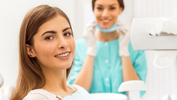 Orthodontic patient getting a check up at her modern orthodontist