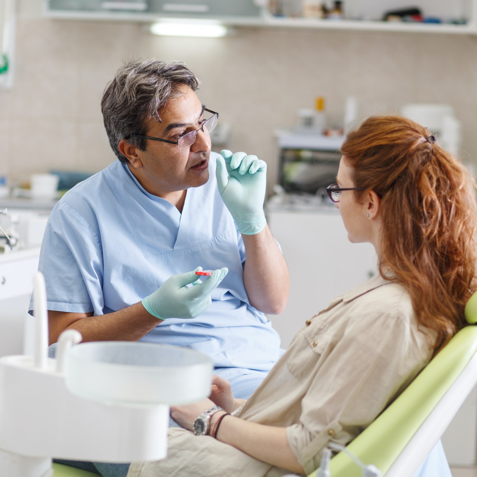 dentist explaining braces to his ortho patient