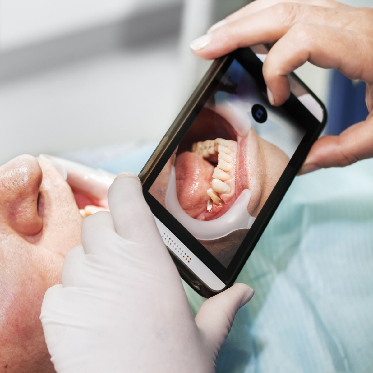 A dentist using the OrthoPhoto app