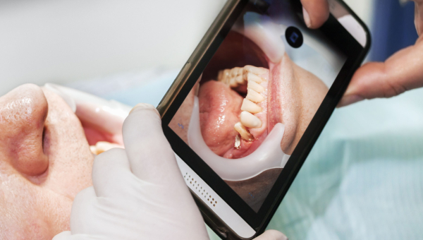 A dentist using the OrthoPhoto app