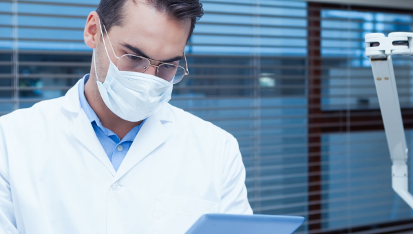 A dentist using the OrthoPhoto app